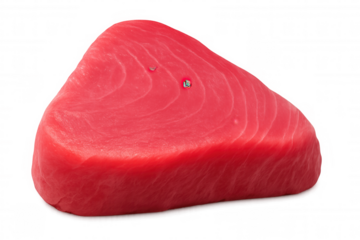 Fresh tuna steak lying on transparent surface, highlighting protein-rich seafood and culinary elegance