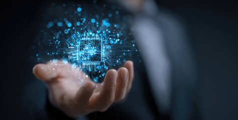 A person's hand holds a holographic microchip