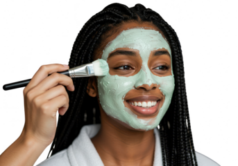 Young woman applying a green facial mask with a brush, isolated on transparent background