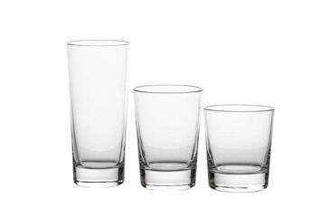 A set of three clear drinking glasses of varying sizes and shapes, isolated on a transparent background, ready for beverages