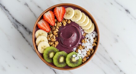 Açaí, A top down view of a wooden bowl filled with an acai smoothie and various fruit toppings arranged neatly