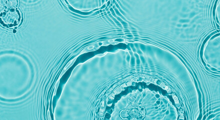 Macro water ripples with concentric circles and glossy reflections on cyan, abstract aqua background perfect for wellness visuals, technology headers and brand design