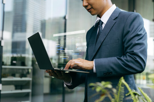 Management diagram with planning software on laptop screen.