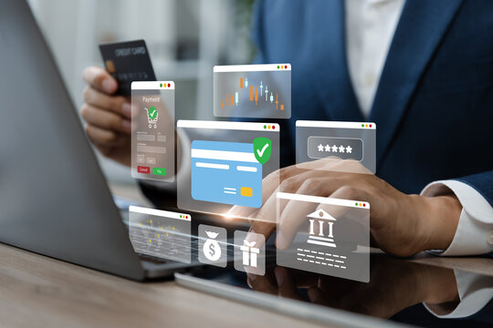 Hand Using laptop with holding credit card for transaction.