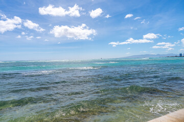 view of Waikiki Beach, Honolulu, Hawaii, with vibrant sunset skies, turquoise waters, and beachfront hotels. Perfect for travel, vacation, tourism, and real estate 