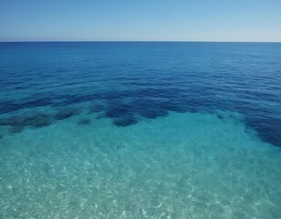 Obraz premium Clear Shallow Ocean Water Meeting Sandy Beach – Serene Tropical Seascape