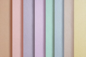 Pastel striped paper texture background with pink, blue, lavender, peach and yellow tones