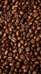 Fototapeta premium Rich, dark roasted coffee beans create a warm, aromatic backdrop for morning energy and cozy moments.