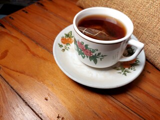 cup of coffee on wooden table
