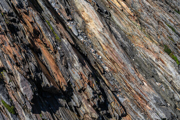  Slate and Graywacke. Slate is a fine-grained, foliated, homogeneous, metamorphic rock. Lu Young Public Beach / Lu Young Park, Whittier is a city  in the Chugach Census Area in Alaska. 
