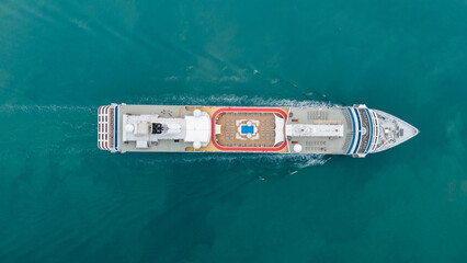Aerial view of beautiful white cruise ship above luxury cruise in the ocean sea at early in the morning time concept smart tourism travel on holiday vacation time on summer