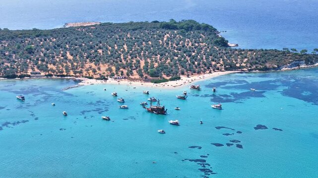 4k drone video of Garip and Kalem islands with turquoise sea and coral reefs in Bademli. Dikili, a district of Izmir famous for its turquoise sea in Turkiye.