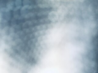 Soft blurred abstract background in gray and blue tones with smooth gradient light and shadows, perfect for design, presentation, wallpaper, or creative projects.