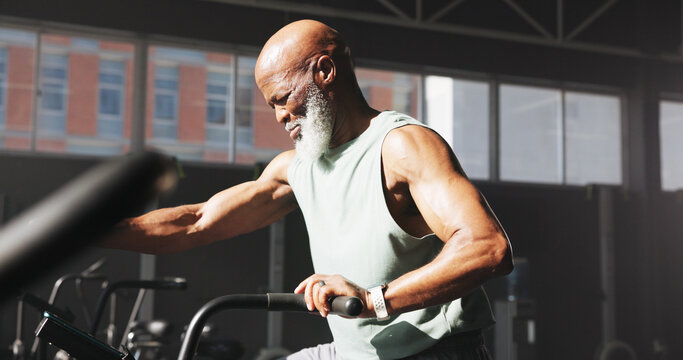 Fitness, black man or exercise bike at gym for cardio, workout challenge or burning calories. Athlete, mature person or elliptical machine at wellness club for physical training, endurance or cycling