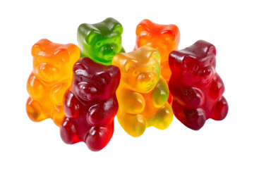 Colorful gummy bears clustered together on a stark transparent background in close up studio shot