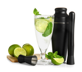 Glass of fresh Mojito cocktail with mint and bar tools on white background