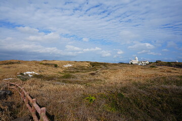 fine landscape with meadows and house and clouds