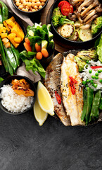Table scene of various delicious foods. Healthy, family dinner.