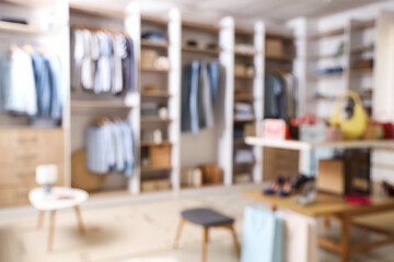 Blurred view of boutique with stylish clothes and accessories