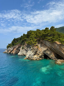 Layered rocks and turquoise sea in Montenegro.