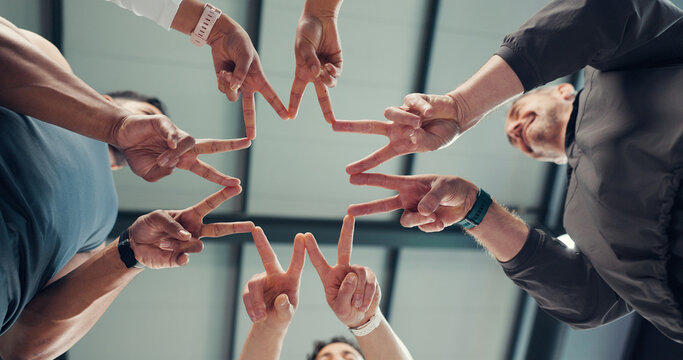 Below, star and hands of people with fitness team, partner or solidarity with shape for support in gym. Group, peace sign and trust in exercise community, synergy and connection for health together - Powered by Adobe
