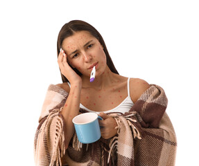 Young woman ill with chickenpox and cup measuring temperature on white background
