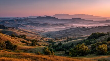 Fototapeta premium Misty mountain range at sunrise