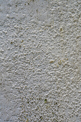 White cement wall with aged rough textured surface