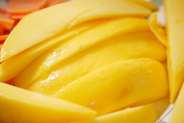 Fresh mango slices ready to enjoy at tropical gathering
