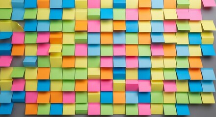 Colorful Sticky Notes Wall: A vibrant collection of multicolored sticky notes arranged in a grid pattern, creating a dynamic and visually stimulating texture.