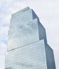 Bottom up view office building on blue sky background