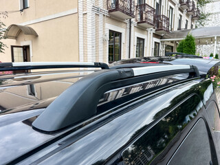 This closeup image showcases a stylish car roof rack that combines practicality and aesthetics, perfect for modern transport, outdoor adventures, and family trips, creating lasting memories