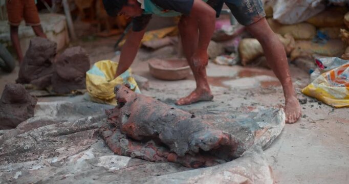 Indian Clay Artist: Preparing Clay with Feet for Ganesh Idol Making