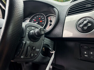 An Informative and Detailed Interior View of a Car Dashboard Showcasing the Steering Wheel Controls Alongside the Speedometer, Emphasizing Both Functionality and Innovative Design Features