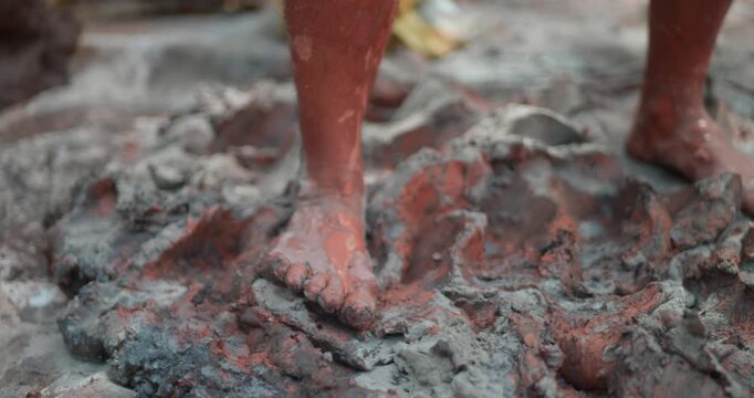 Indian Clay Artist: Preparing Clay with Feet for Ganesh Idol Making