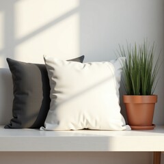 Pillow mockup two pillows on a white surface with a potted plant casting shadows against a wall in a bright room