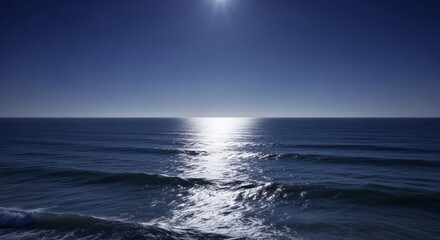 Obraz premium Silvery moonlight across sea expanse, ocean water surface with reflection, night casting blue toward horizon line