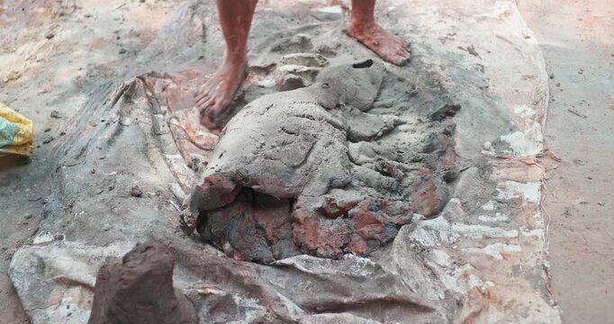 Indian Clay Artist: Preparing Clay with Feet for Ganesh Idol Making