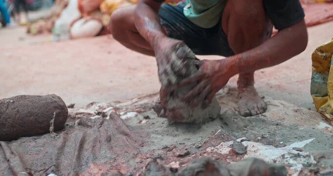 Indian Clay Artist: Preparing Clay with Feet for Ganesh Idol Making