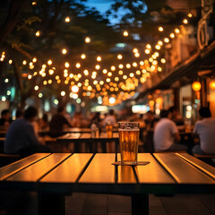 Outdoor restaurant at night with string lights and people dining