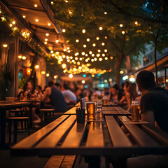 Outdoor restaurant at night with string lights and people dining