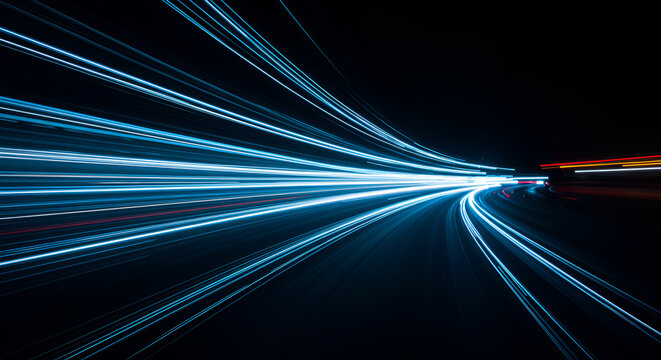 Abstract motion blur of light trails on a dark background showcasing speed