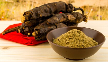Dried plant parts and powder on a wooden surface