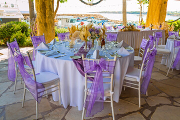 Traditional Greek restaurant in Paphos, Cyprus — whitewashed walls, blue accents, and blooming flowers set the scene for delicious local cuisine in a charming Mediterranean atmosphere.