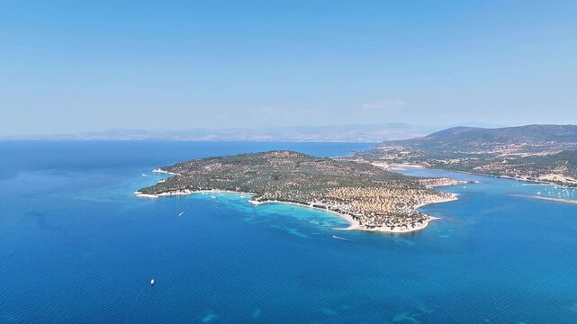 4k drone video of Garip and Kalem islands with turquoise sea and coral reefs in Bademli. Dikili, a district of Izmir famous for its turquoise sea in Turkiye.