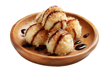 Coconut rice balls or dumplings topped with syrup and shredded coconut on wooden plate, isolated on white transparent background, concept of Polynesian Snacks Faikakai dessert cuisine