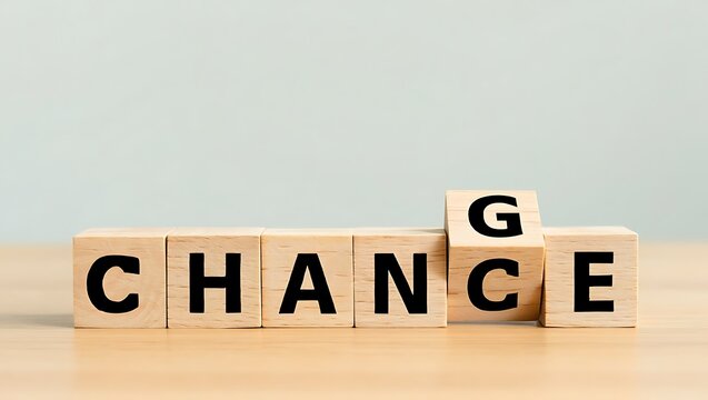 Wooden blocks spelling out the word chance with one block flipped to spell change