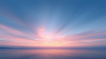 Obraz premium Colorful serene sunset sky over calm water horizon with dreamy pastel clouds in soft pink and blue tones, creating tranquil abstract nature background and peaceful atmosphere