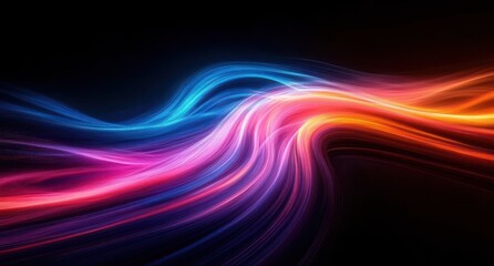 Obraz premium Dynamic flowing light streaks in vibrant blue, pink, purple, and orange colors against a dark background creating a sense of motion and energy