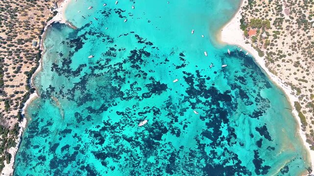 4k drone video of Garip and Kalem islands with turquoise sea and coral reefs in Bademli. Dikili, a district of Izmir famous for its turquoise sea in Turkiye.